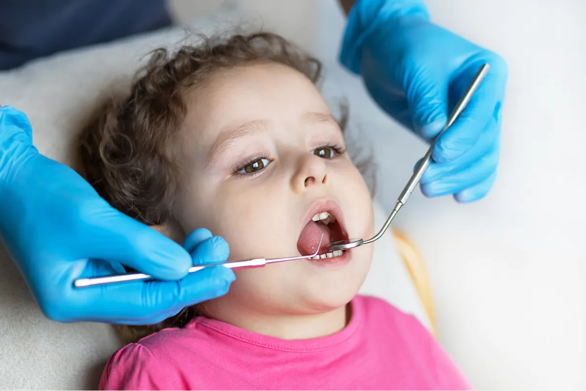 Young child receiving a gentle dental checkup